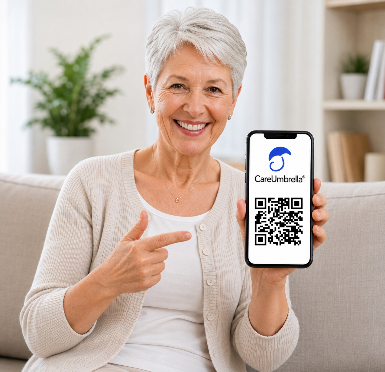 Older woman holding a phone showing the CareUmbrella logo and QR code